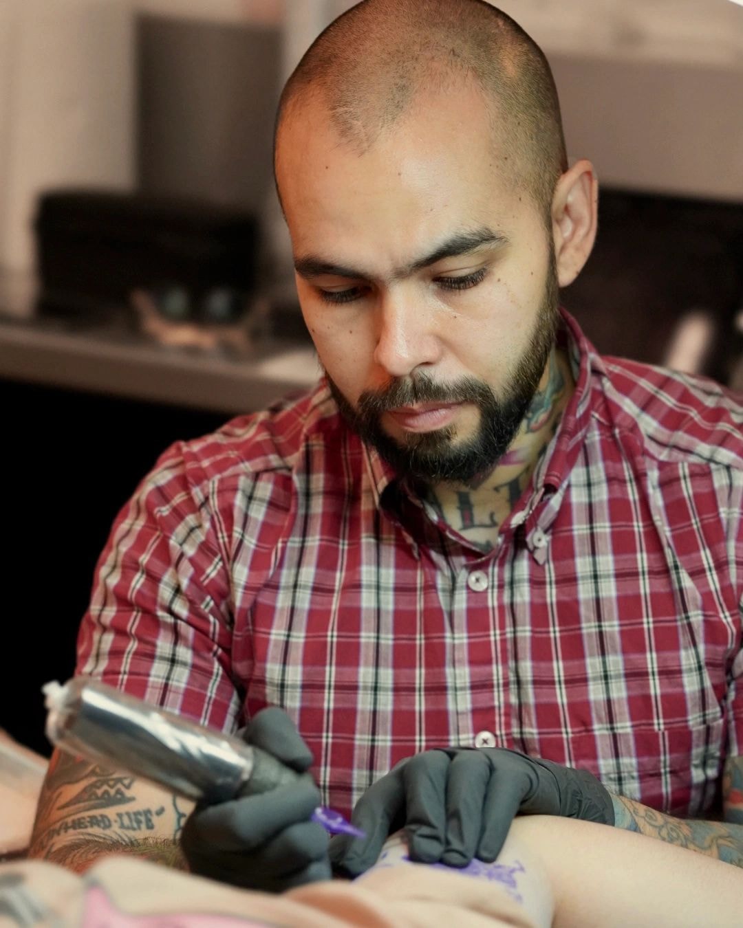 Close-up of a fine line tattoo in progress on skin